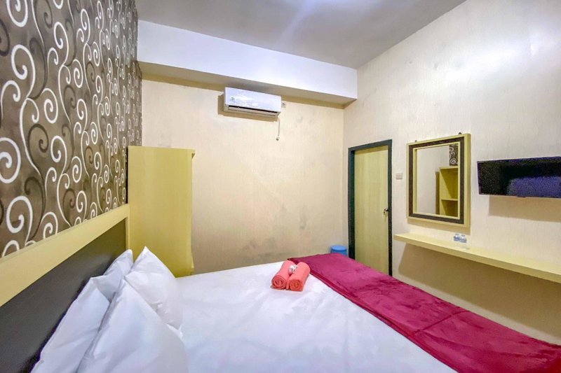 Tini's Guest House Malang Mitra RedDoorz, Betek, Indonesia