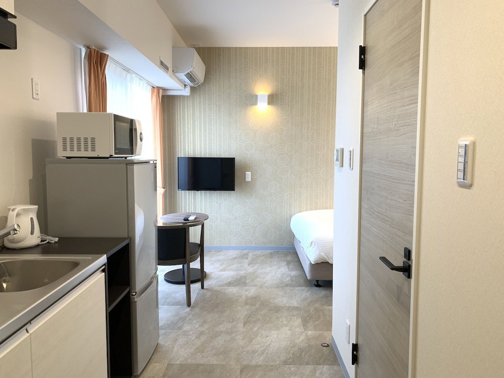 Hotel · Mr.KINJO Miki24 in front of Makishi Station, Naha