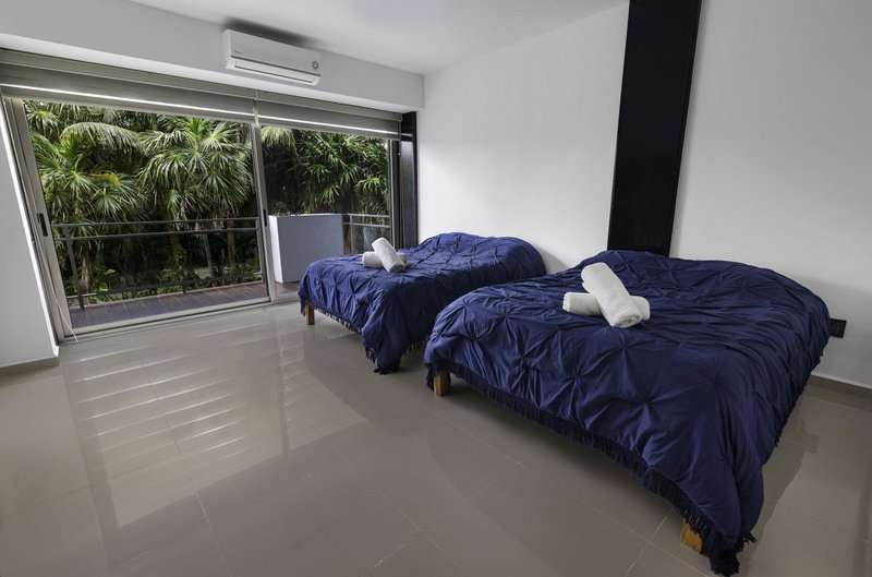 Angelina 28 Beachfront and Family Apartments - Modern and Relaxing Long Stays - 20 min from Cancun Airport, Puerto Morelos, Mexico