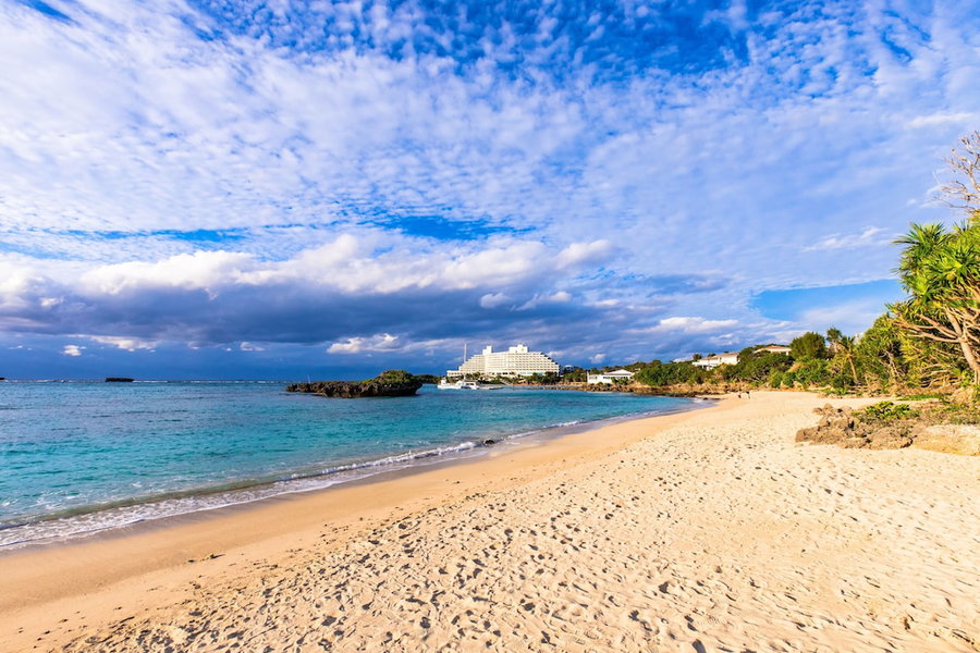 Mr.KINJO in front of Manza Beach, Onna, Japan